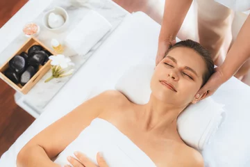 Poster Panorama top view of woman enjoying relaxing anti-stress head massage and pampering facial beauty skin recreation leisure in dayspa modern light ambient at luxury resort or hotel spa salon. Quiescent © Summit Art Creations