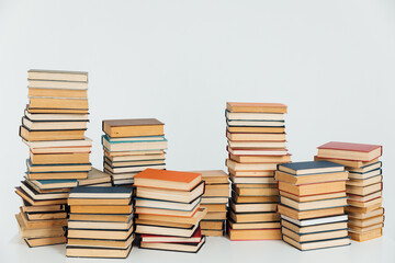 Stacks of old books in study library on white background