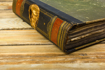 Ancient book, hardcover on a wooden table. Back to school. Copy space for text. The concept of...