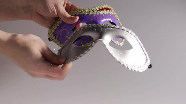 Set of Carnival masks in hands on white background, a theatrical and vintage accessories for a stage event