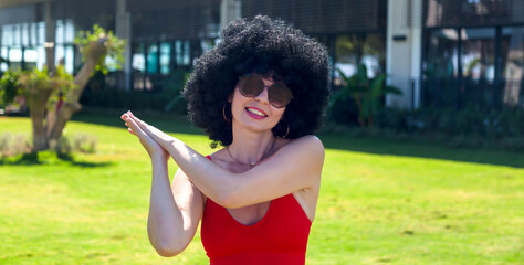A girl claps her hands showing movements morning exercises.