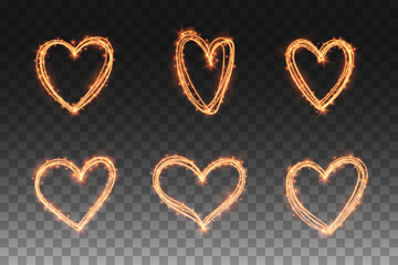 Heart shape golden fireworks light glow effect on transparent background for love romantic valentine day card, web site banner. Magic gold sparkles frames for text message