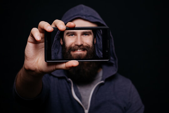 Hipster man beard taking picture smartphone self-portrait, screen view