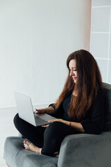 Woman working online on laptop small business at home