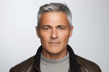 Foto op Canvas Portrait of handsome mature man with grey hair in leather jacket. © Nerea