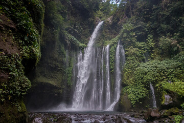 Fototapeta na wymiar Tropical waterfall after an intense waterfall close to Mount Rinjani, Lombok island, indonesia