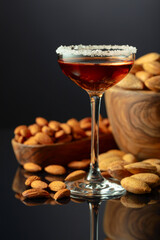 Italian liqueur Amaretto with almonds nuts on a black background.