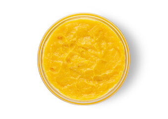 Fresh mashed mango in bowl on white background.Top view.Macro.