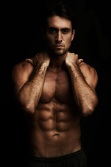 Six pack, black background or portrait of man for workout, training or exercise in studio for...