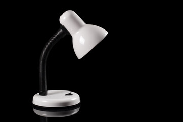White desk lamp isolated on black