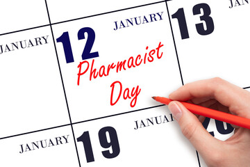 January 12. Hand writing text Pharmacist Day on calendar date. Save the date.