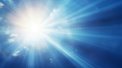 Sun in blue sky. Warm solar lens flare in clear skies