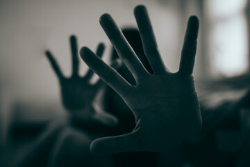 The woman held up her five-fingered hands, intent on telling her not to interfere. Concept of...