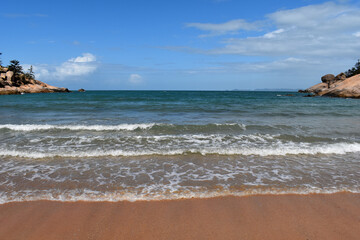 Fototapeta na wymiar Waves breaking on beach, Alma Bay, Magnetic Island, Queensland, Australia
