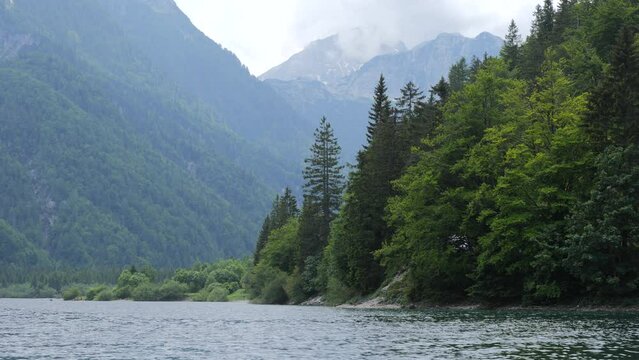 Lake Lago del Predil in Italy and Misty Mountains in the Background in Summer