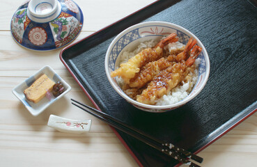 Tempura Donburi (Tendon) is crisp tempura laid over freshly steamed rice and topped with a delicious soy sauce based dressing.