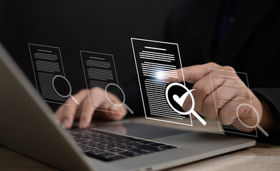 Performance checklist concept : businessman using stylus pen with laptop for questionnaire,...