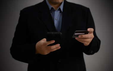 Concept e banking or e commerce : business man using his mobile for payment by wallet app technology or digital money transfer after his shopping something by application .	