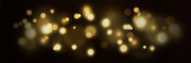 Blurred shining shiny bokeh on a dark background. Festive background.
