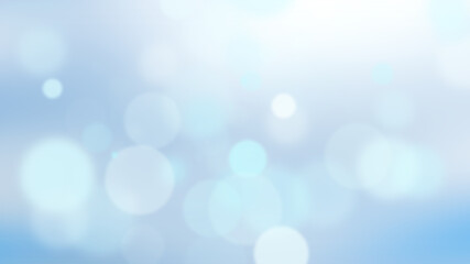 A bokeh background with blue and white circles. The circles are different sizes and are arranged in a random pattern. The background is blurred, which accentuates the bokeh effect.