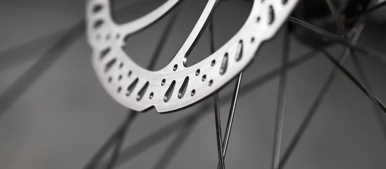 Foto op Canvas Bicycle disk brakes close up, metal disc attached to bike wheel, effective mountain bicycle brakes © Aurel