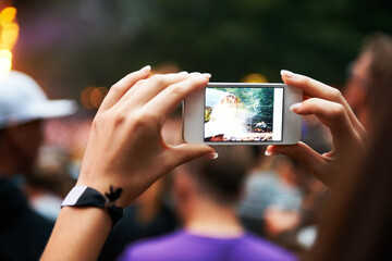 Person, hands and music festival or cellphone picture or entertainment stage, party concert or...
