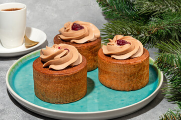 Cakes filled with cream and cherry jam. Box eclairs. New Year and holiday concept.