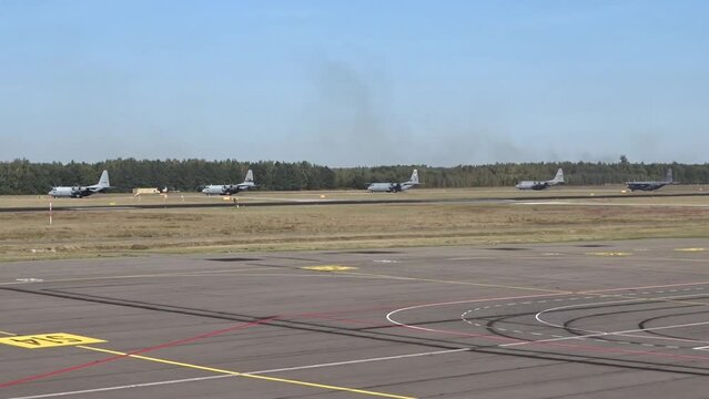 Military Airplanes Taxiing at Air Base
