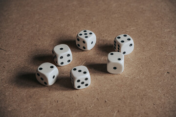 Gaming dice on a wooden background