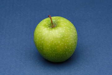green apple on blue