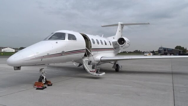 Generic White Private Jet Slow Panning Parked at Airport