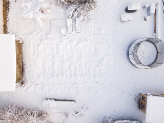 aerial drone flight over pool covered with tarpaulin in winter, snow, cold