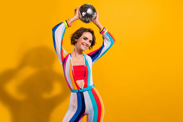 Photo of beautiful model woman retro style outfit dance demonstrate hands raised up disco ball...