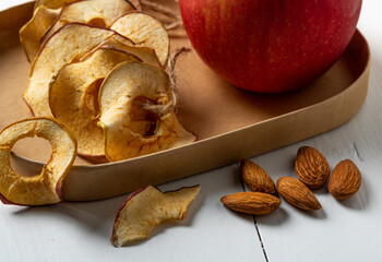 Apple chips and nuts. A tasty and healthy snack.