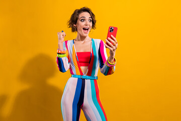 Photo of overjoyed positive girl wear stylish striped costume talking video call celebrating new...
