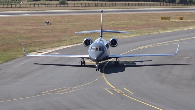 Black Generic Unmarked Private Jet Taxiing Head On after Landing at Local