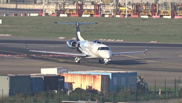 Business Jet Taxiing head on at international airport 