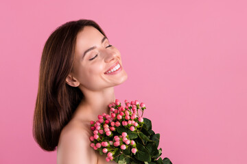 Photo of charming pretty girl with roses bouquet enjoy organic vitality shower with herbal lotion product isolated over pastel color background