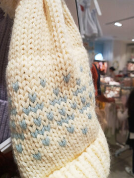 white wool hat with blue pattern