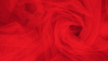 Fabric fatin red color twisting as background. Textured background for atelier.