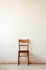 A lone chair against a wall isolated on white background