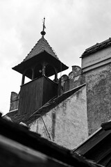 Fototapeta na wymiar Dracula Castle with chimney and small roof in Bran Castle, Törzburg or Castelul Bran in Bran Village, Transylvania in Romania in black and white
