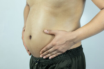 Naklejka premium Men with pot bellies or belly fat. Close-up of body parts