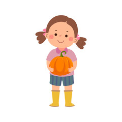 Little girl farmer holding a large pumpkin in her hands - 690661803