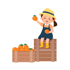 Little girl sitting on wooden nearby boxes with the harvest of the oranges
