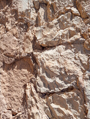Abstract grunge background. Old brown rough stonewall texture.