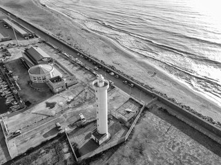 Aerial view from drone of lighthouse near harbor entrance