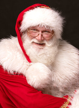 Portrait of real happy Santa Claus with white beard.