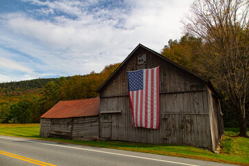 Fototapeta premium American flag on a barn in rural Vermont.
