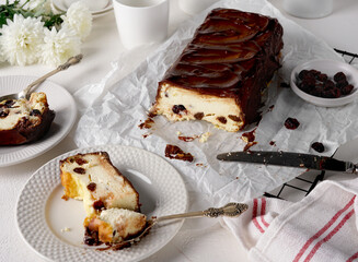 Lviv cheesecake, a traditional Ukrainian dessert with raisins, coated with chocolate icing